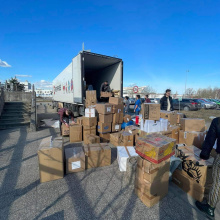 Volunteers of 'Students for Ukraine' unload a truck with gifts, which arrived from Norway