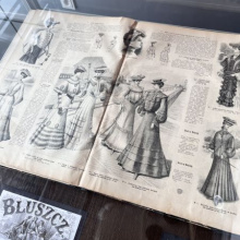 A magazine from Special Collections opened with a page showing women's summer outfits.